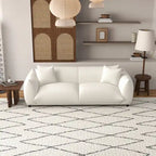 Sofá Mansan de lujo moderno de mediados de siglo con respaldo de almohada apretada y tapizado en bouclé francés color crema