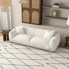 Sofá Mansan de lujo moderno de mediados de siglo con respaldo de almohada apretada y tapizado en bouclé francés color crema