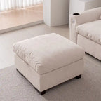 Sofá seccional reversible de chenilla en forma de L de color beige con otomana, puertos USB y portavasos